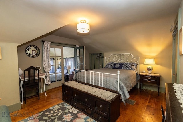 300 Holmes, Butte, MT 59701 - bedroom with dark wood-style flooring and vaulted ceiling