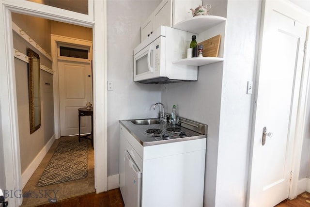 300 Holmes, Butte, MT 59701 - kitchen with open shelves, white cabinetry, white microwave, and wood finished floors