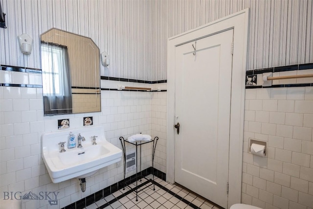 300 Holmes, Butte, MT 59701 - bathroom featuring tile walls, wallpapered walls, and tile patterned flooring