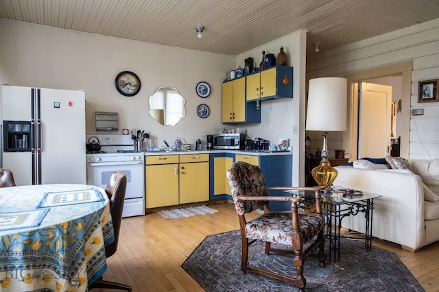 300 Holmes, Butte, MT 59701 - kitchen with white appliances, light countertops, and light wood-type flooring