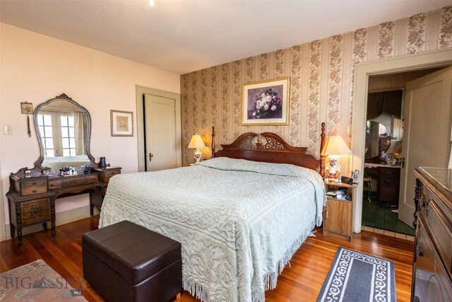 300 Holmes, Butte, MT 59701 - bedroom with wood finished floors and wallpapered walls