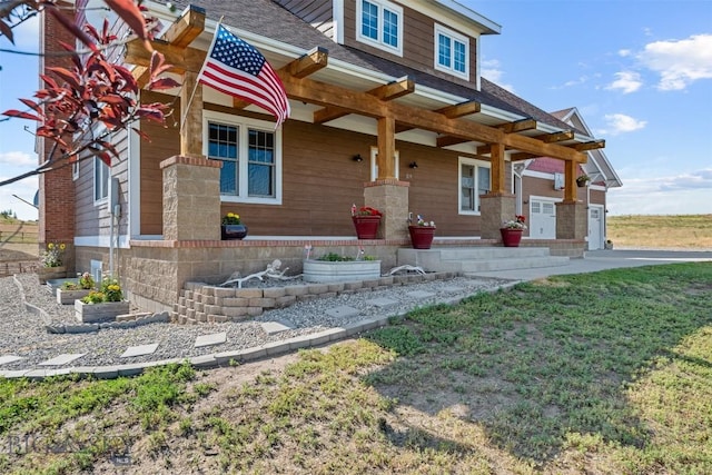 219 Rolling Glen Ranch Loop, Three Forks, MT 59752 - view of front of home with covered porch, a front lawn, and a shingled roof