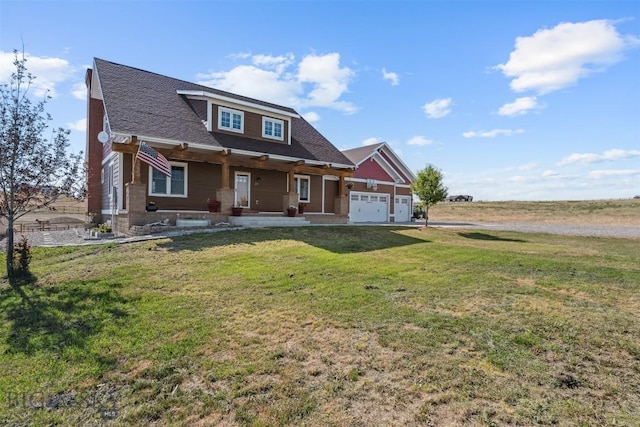 219 Rolling Glen Ranch Loop, Three Forks, MT 59752 - view of front of property with a porch, a front yard, a garage, and driveway