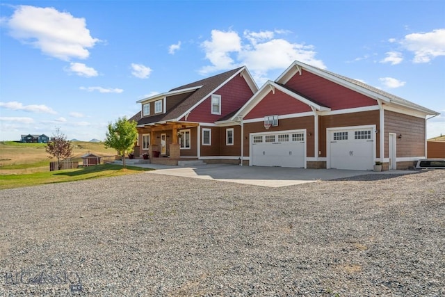 219 Rolling Glen Ranch Loop, Three Forks, MT 59752 - view of front facade featuring driveway, a garage, and covered porch