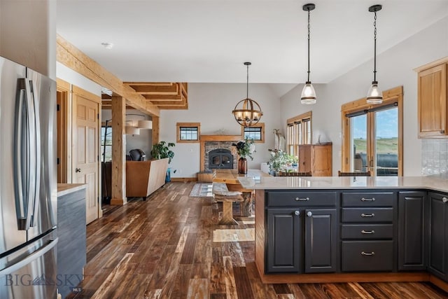219 Rolling Glen Ranch Loop, Three Forks, MT 59752 - kitchen with freestanding refrigerator, light countertops, open floor plan, and lofted ceiling