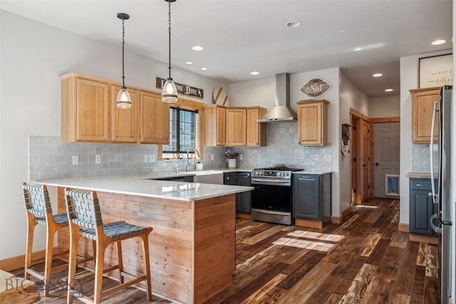219 Rolling Glen Ranch Loop, Three Forks, MT 59752 - kitchen with stainless steel appliances, wall chimney exhaust hood, a peninsula, dark wood-style flooring, and light brown cabinets