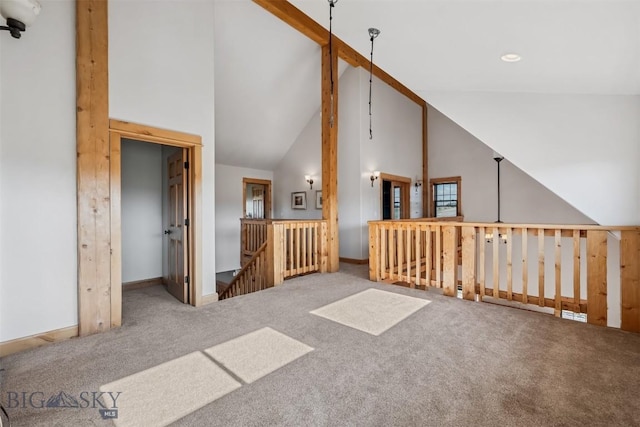 219 Rolling Glen Ranch Loop, Three Forks, MT 59752 - unfurnished living room with high vaulted ceiling and carpet