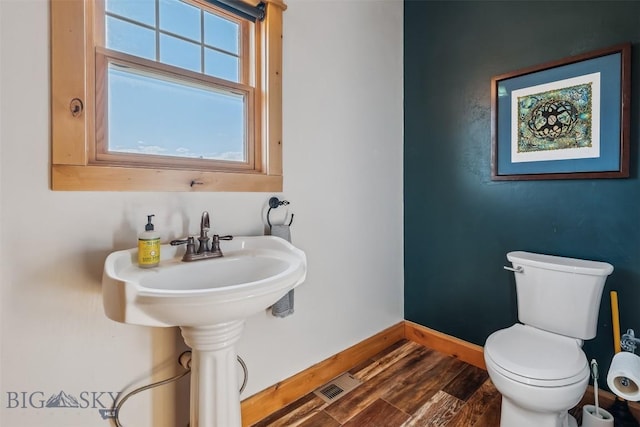 219 Rolling Glen Ranch Loop, Three Forks, MT 59752 - half bathroom with baseboards and wood finished floors