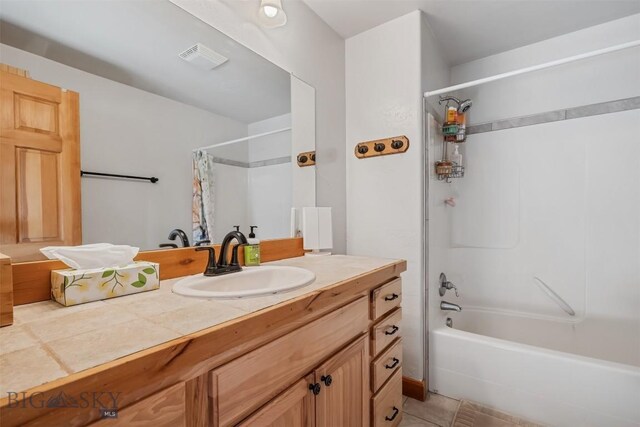 219 Rolling Glen Ranch Loop, Three Forks, MT 59752 - full bathroom featuring vanity, shower / tub combo, and tile patterned floors