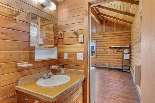 3500 Jackson Creek Rd, Bozeman, MT 59715 - bathroom featuring wood ceiling, rustic walls, wood finished floors, and vanity