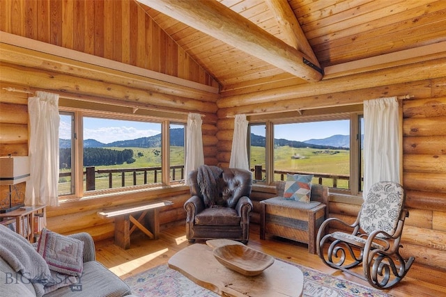 3500 Jackson Creek Rd, Bozeman, MT 59715 - living room with a mountain view, wooden ceiling, rustic walls, wood finished floors, and healthy amount of natural light