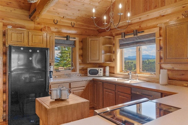 3500 Jackson Creek Rd, Bozeman, MT 59715 - kitchen featuring freestanding refrigerator, log walls, white microwave, wood ceiling, and lofted ceiling