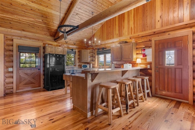3500 Jackson Creek Rd, Bozeman, MT 59715 - kitchen with freestanding refrigerator, white microwave, a wood ceiling with exposed beams, open shelves, and a peninsula