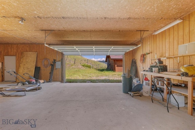 3500 Jackson Creek Rd, Bozeman, MT 59715 - garage with wooden walls and a workshop area