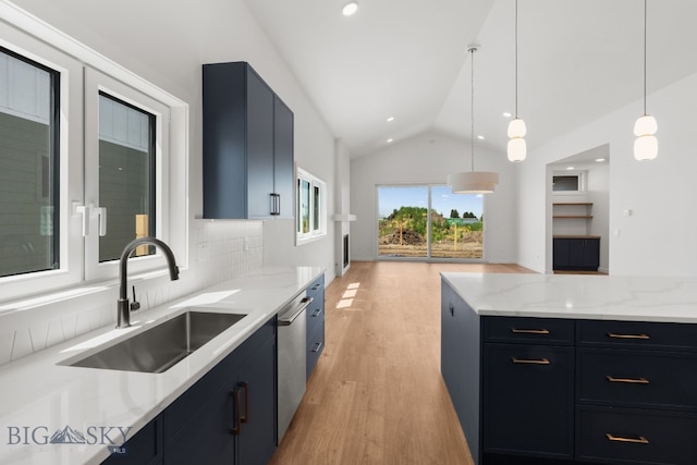 2809 S 30th Ave, Bozeman, MT 59718 - kitchen with lofted ceiling, light wood finished floors, pendant lighting, light stone countertops, and stainless steel dishwasher
