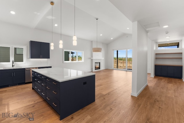 2809 S 30th Ave, Bozeman, MT 59718 - kitchen with stainless steel dishwasher, open floor plan, dark cabinetry, recessed lighting, and hanging light fixtures