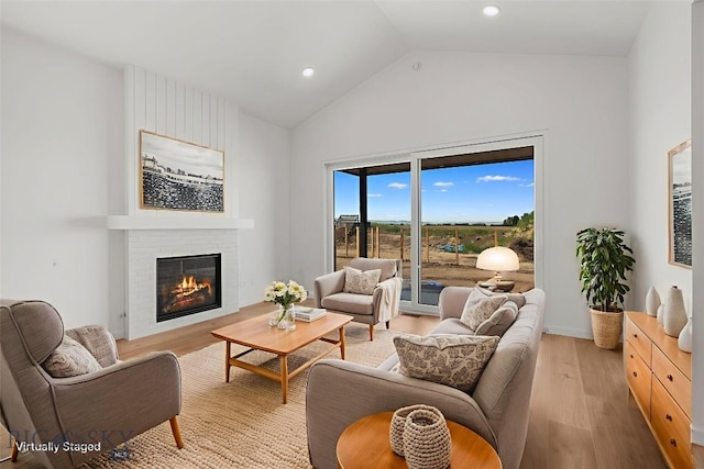2809 S 30th Ave, Bozeman, MT 59718 - living area with light wood-style flooring, a fireplace, recessed lighting, and high vaulted ceiling