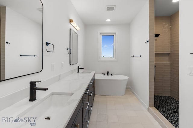 2809 S 30th Ave, Bozeman, MT 59718 - full bath featuring double vanity, a freestanding tub, tiled shower, tile patterned floors, and recessed lighting