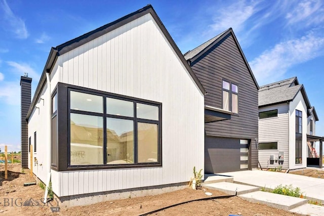 2809 S 30th Ave, Bozeman, MT 59718 - view of home's exterior with concrete driveway and an attached garage