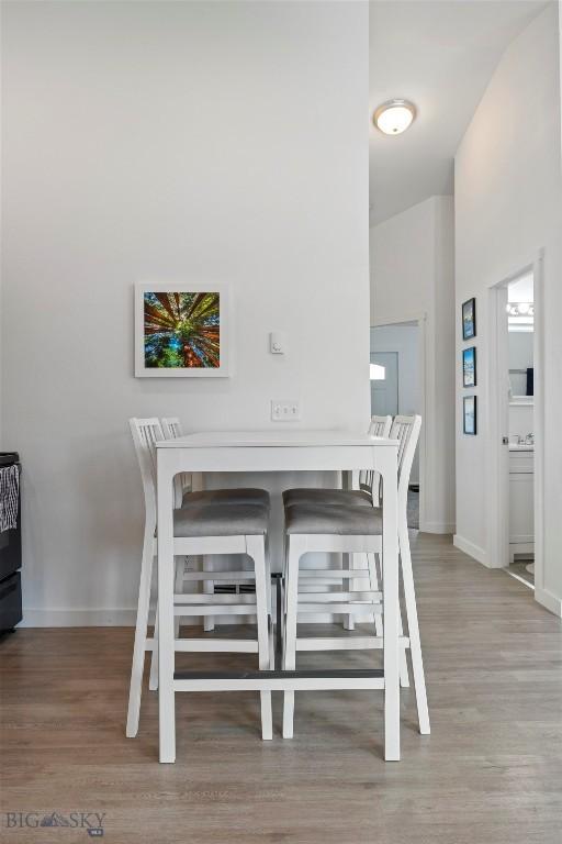 402 Brookline St Unit B, Livingston, MT 59047 - dining room featuring wood finished floors and baseboards