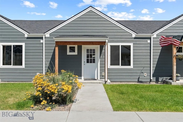 402 Brookline St Unit B, Livingston, MT 59047 - view of front of house featuring roof with shingles and a front lawn
