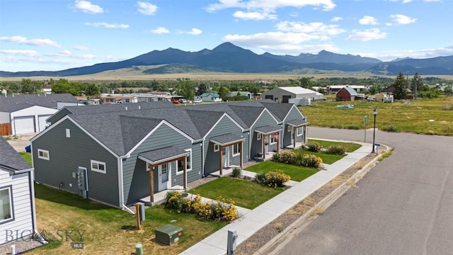 402 Brookline St Unit B, Livingston, MT 59047 - view of front of property with a mountain view, roof with shingles, a residential view, and a front yard