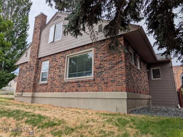 944 Placer, Butte, MT 59701 - view of side of home with a chimney and a yard