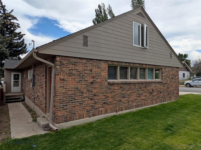 944 Placer, Butte, MT 59701 - view of property exterior featuring a lawn and brick siding