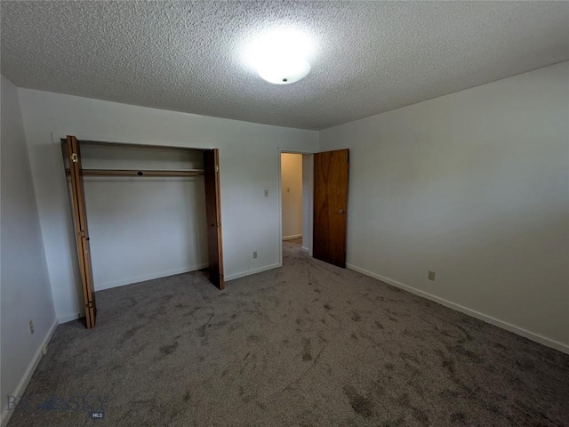 944 Placer, Butte, MT 59701 - unfurnished bedroom featuring a closet, carpet flooring, and a textured ceiling