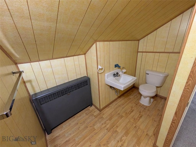 944 Placer, Butte, MT 59701 - bathroom with radiator, wood finished floors, wood walls, and wooden ceiling