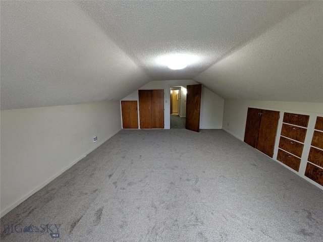 944 Placer, Butte, MT 59701 - bonus room with a textured ceiling, carpet flooring, and lofted ceiling