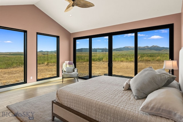 120 Horseshoe Loop, Harrison, MT 59735 - bedroom with a mountain view, wood finished floors, a ceiling fan, a view of rural / pastoral area, and high vaulted ceiling