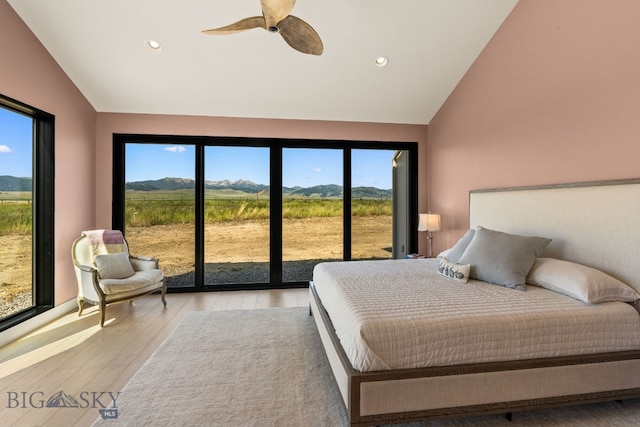 120 Horseshoe Loop, Harrison, MT 59735 - bedroom featuring multiple windows, light wood-style floors, access to outside, a mountain view, and recessed lighting