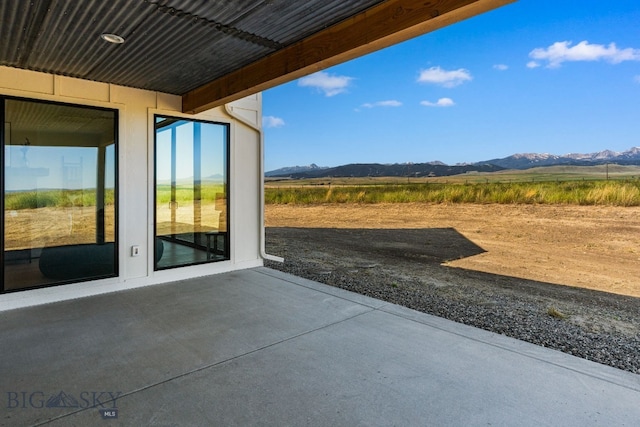120 Horseshoe Loop, Harrison, MT 59735 - view of patio featuring a mountain view