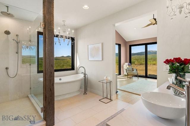 120 Horseshoe Loop, Harrison, MT 59735 - full bath featuring a shower stall, a chandelier, a freestanding tub, vaulted ceiling, and recessed lighting