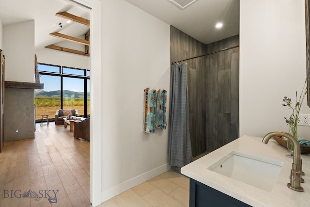 120 Horseshoe Loop, Harrison, MT 59735 - bathroom with vanity, curtained shower, a mountain view, and recessed lighting