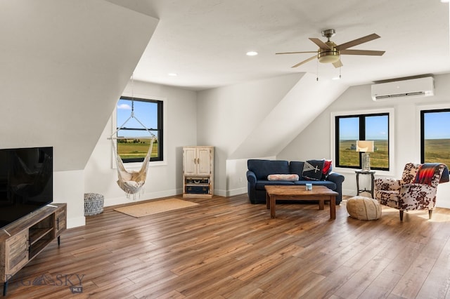120 Horseshoe Loop, Harrison, MT 59735 - living room featuring an AC wall unit, wood finished floors, a ceiling fan, vaulted ceiling, and recessed lighting