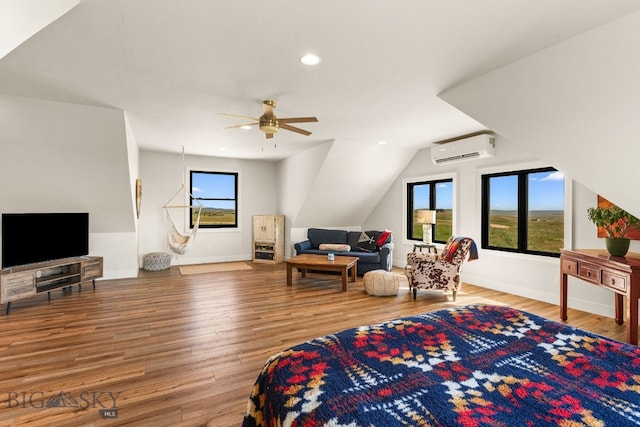 120 Horseshoe Loop, Harrison, MT 59735 - living room featuring a wall unit AC, a ceiling fan, wood finished floors, recessed lighting, and vaulted ceiling