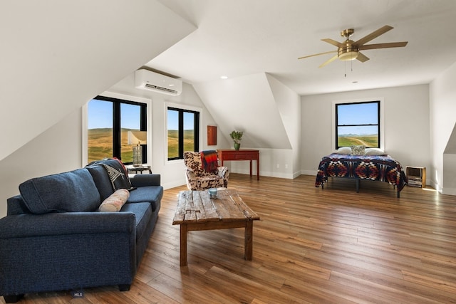 120 Horseshoe Loop, Harrison, MT 59735 - living area featuring a wall unit AC, lofted ceiling, wood finished floors, and ceiling fan