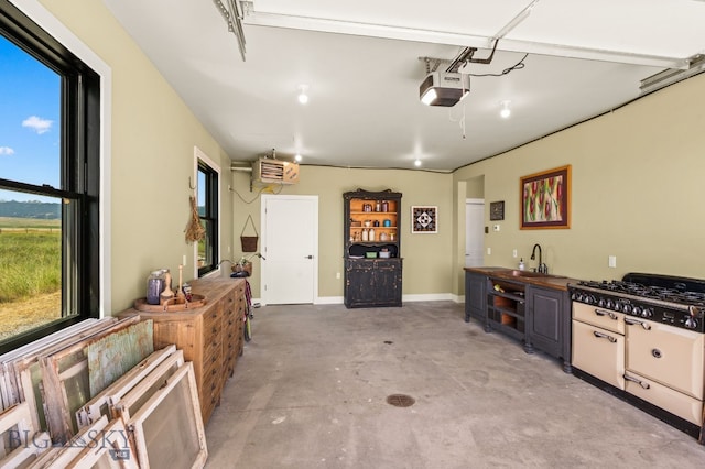 120 Horseshoe Loop, Harrison, MT 59735 - garage with a sink and a garage door opener