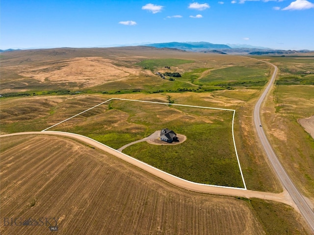 120 Horseshoe Loop, Harrison, MT 59735 - aerial view of property and surrounding area featuring rural landscape and a mountainous background