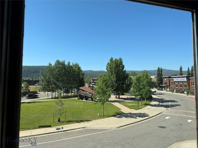 33 Lone Peak Dr Unit 202, Big Sky, MT 59716 - view of asphalt street featuring sidewalks, curbs, and a mountain view
