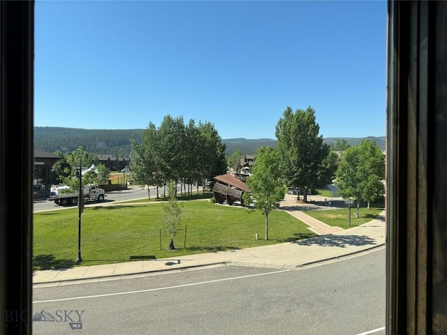 33 Lone Peak Dr Unit 202, Big Sky, MT 59716 - view of community featuring a lawn