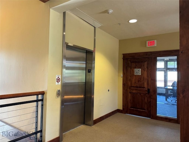 33 Lone Peak Dr Unit 202, Big Sky, MT 59716 - corridor with light colored carpet and elevator