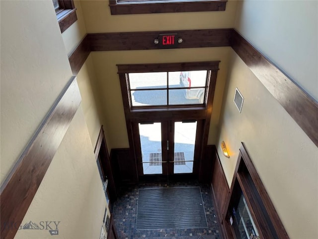 33 Lone Peak Dr Unit 202, Big Sky, MT 59716 - entryway featuring a towering ceiling and french doors