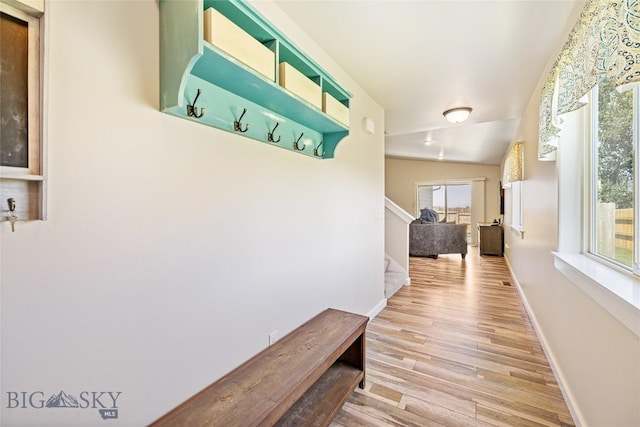 160 Tail Feather Ln Unit D, Bozeman, MT 59718 - hallway with light wood-type flooring and stairs