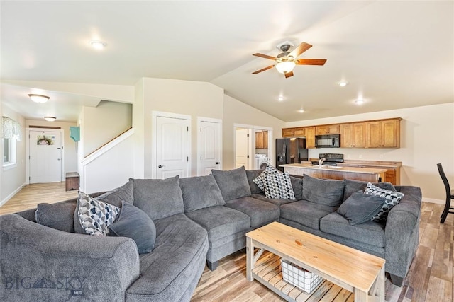 160 Tail Feather Ln Unit D, Bozeman, MT 59718 - living room with a ceiling fan, lofted ceiling, and light wood-style flooring