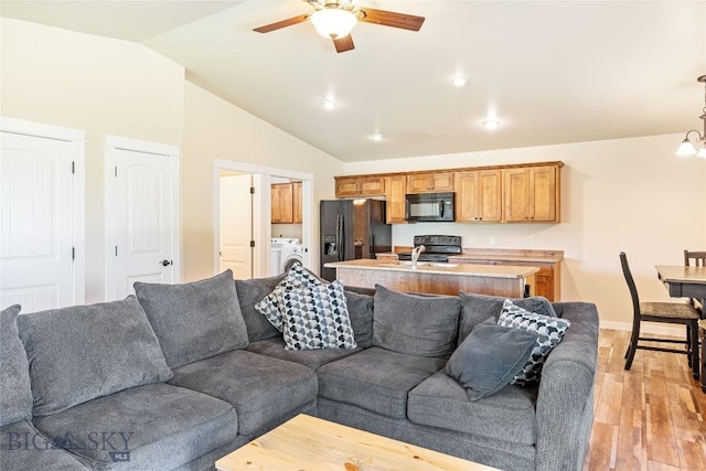 160 Tail Feather Ln Unit D, Bozeman, MT 59718 - living area featuring light wood finished floors, a ceiling fan, and lofted ceiling