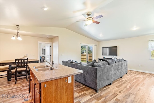 160 Tail Feather Ln Unit D, Bozeman, MT 59718 - living area featuring plenty of natural light, lofted ceiling, light wood-style floors, and ceiling fan