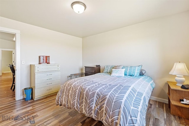 160 Tail Feather Ln Unit D, Bozeman, MT 59718 - bedroom featuring wood finished floors and baseboards